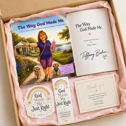 A gift box containing a book titled 'The Way God Made Me' with its printed cover and interior page, plus matching printed cards and stickers. The items are arranged on pink tissue paper inside an open cardboard box.